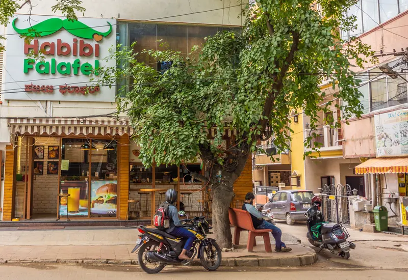 A cafe under a street tree in Koramangala, Bengaluru